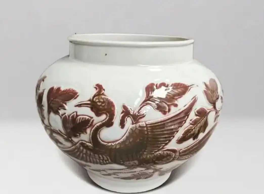 Yuan dynasty underglaze-red jar with a relief phoenix pattern